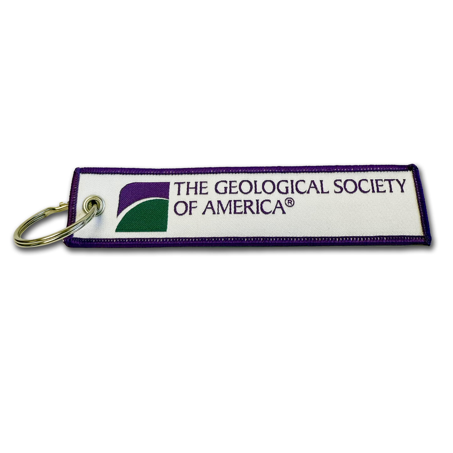 woven keychain with a white background and green and purple logo and purple border