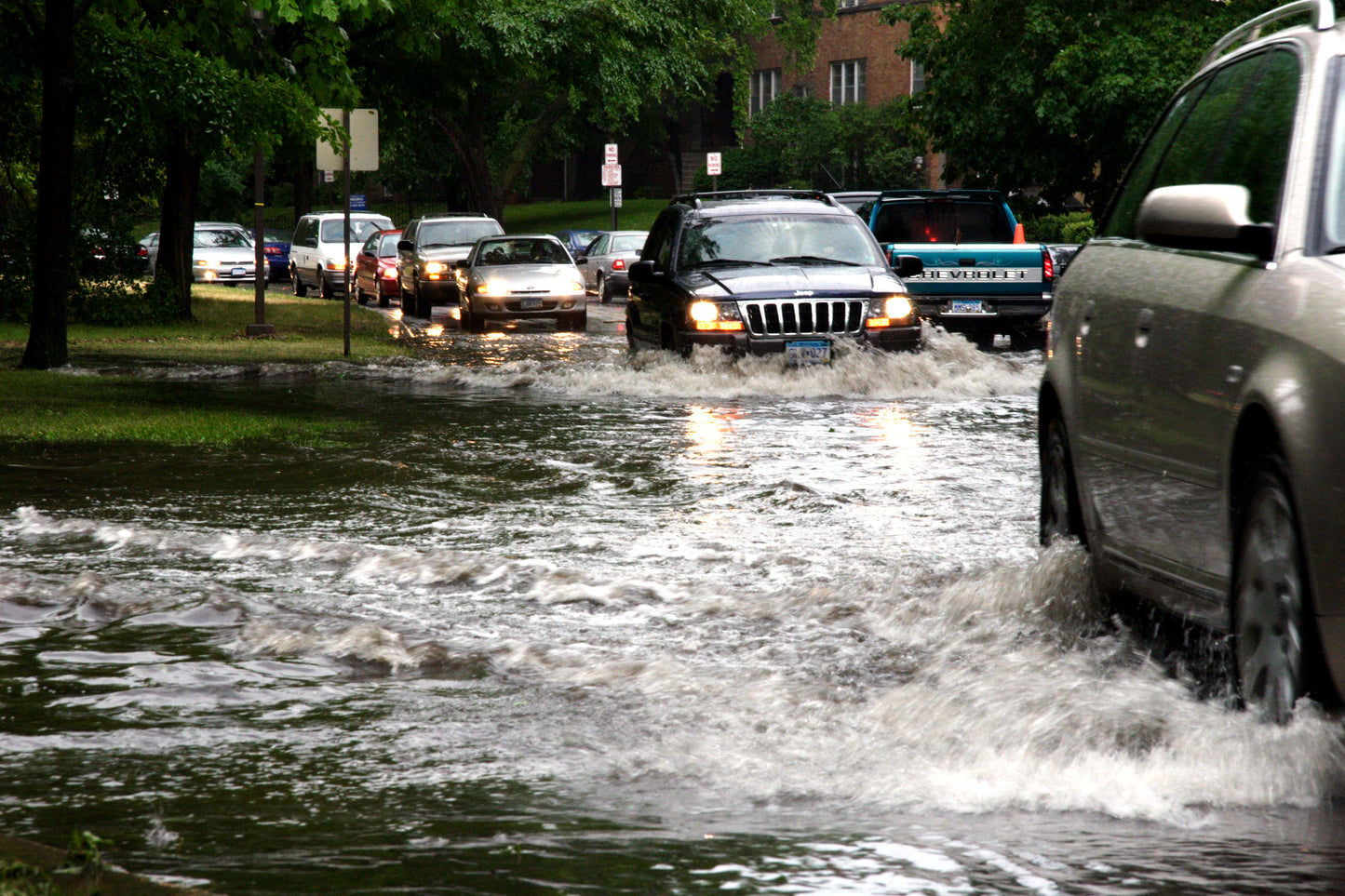 Cars driving through flooded streets. Flood Analysis image.
