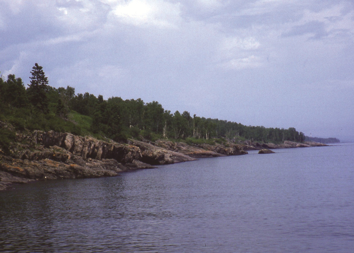 Scenic view of a coastline with trees and rocky terrain, Minnesota