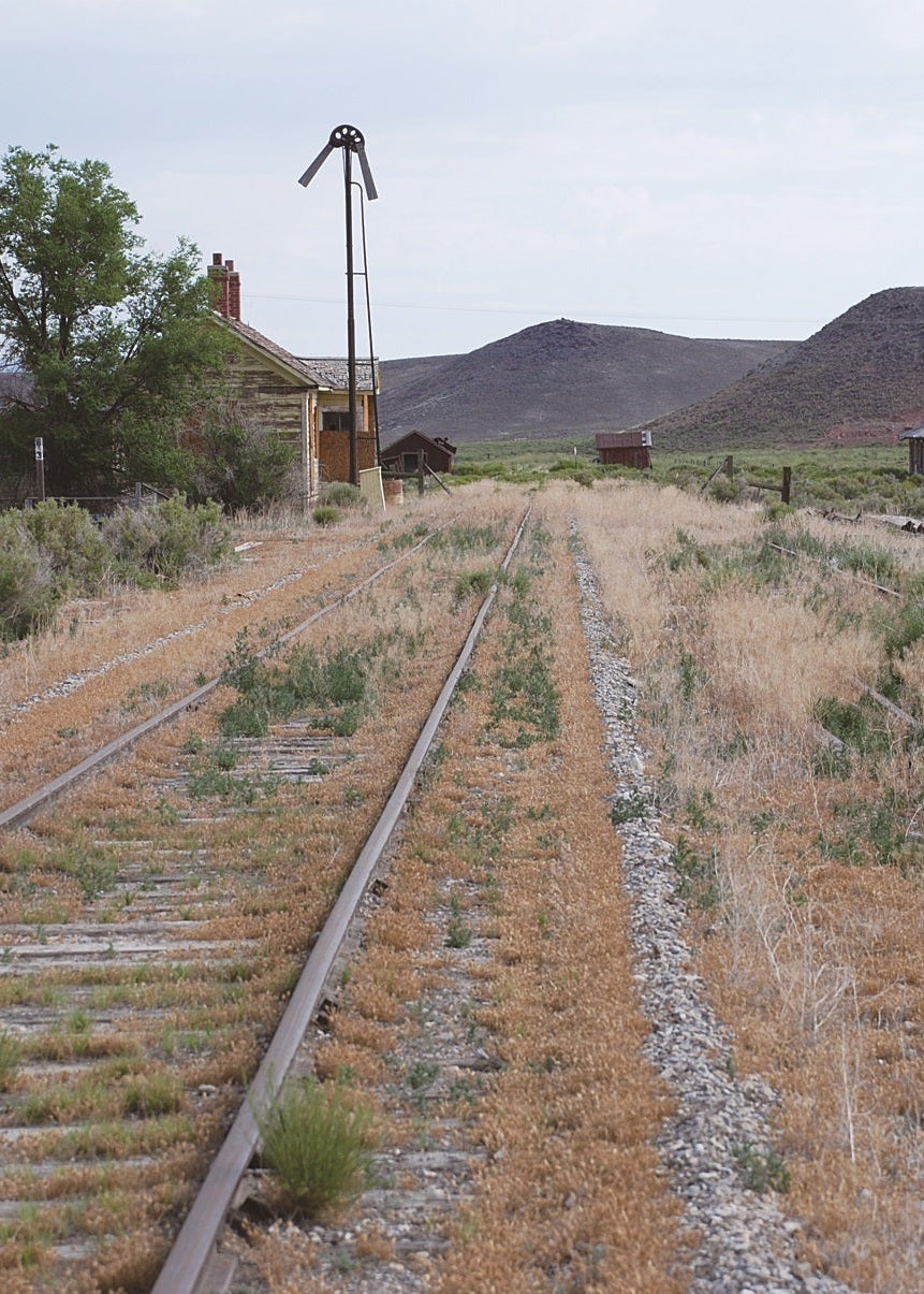 railroad tracks with hills in the background, Nevada