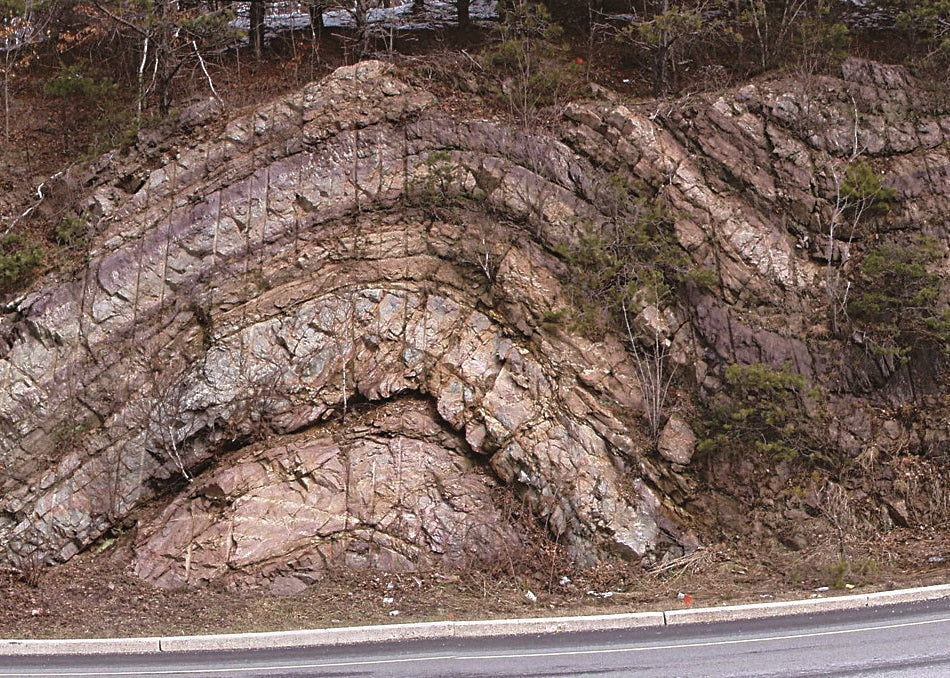 Geological rock formation along a road with trees in the background, New Jersey