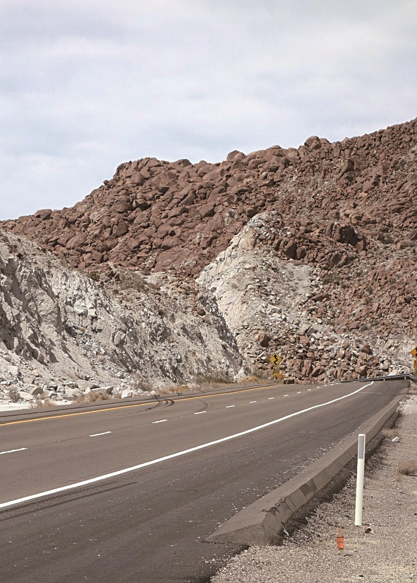 red and white rocks along a highway
