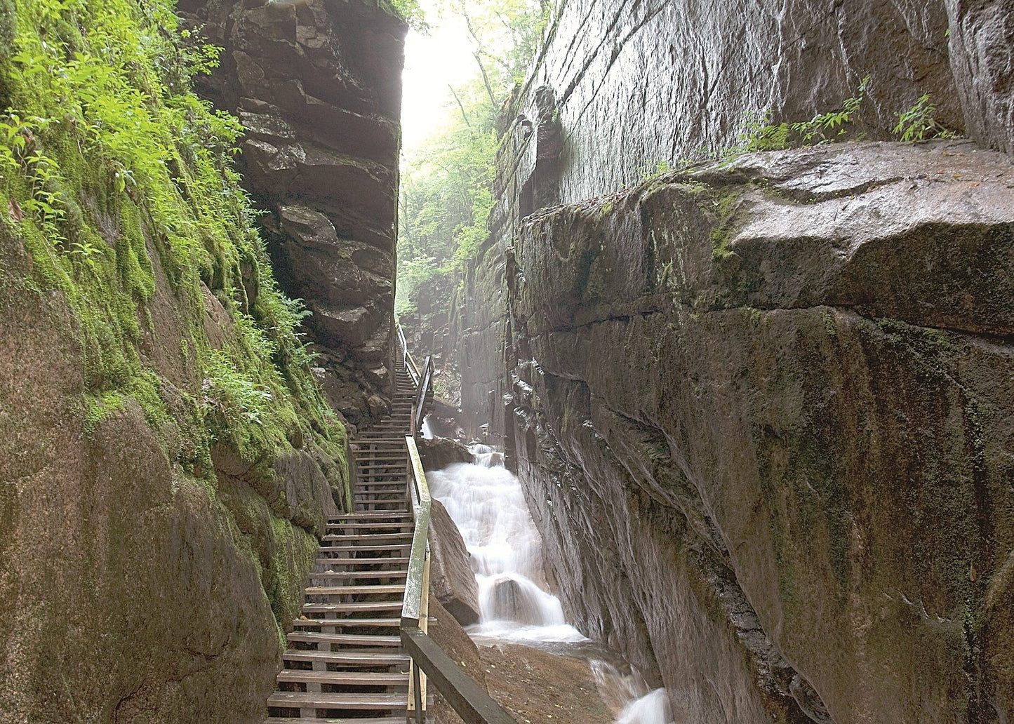 Winding staircase leading through a rocky gorge with waterfalls, Flume Gorge New Hampshire