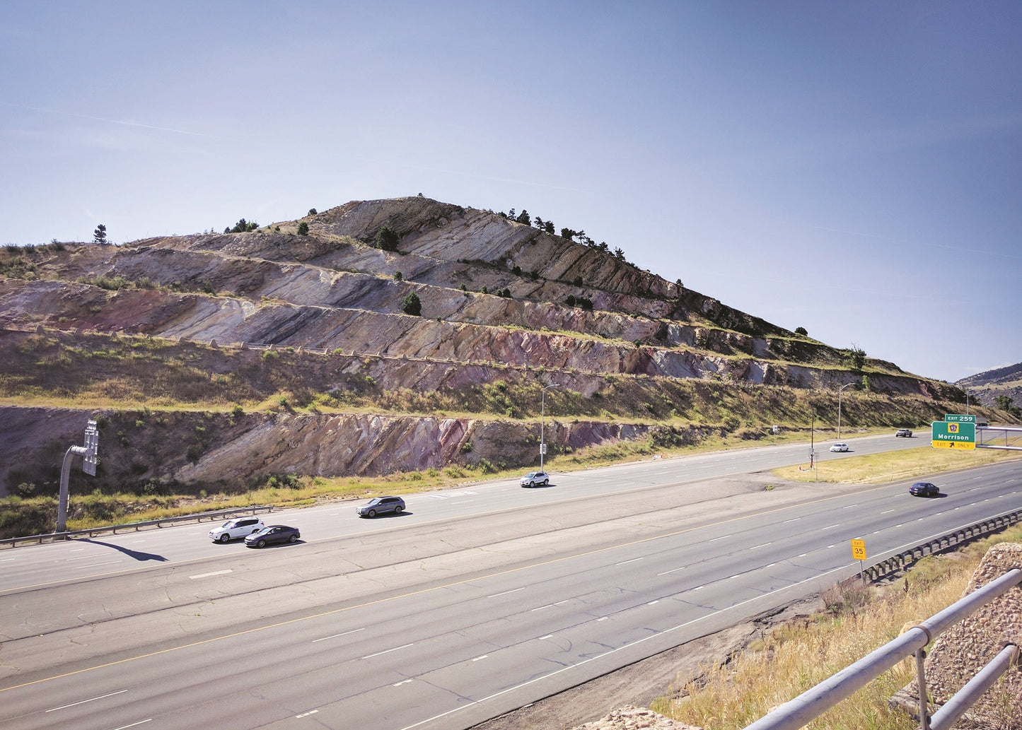 Beds of bright red and yellow sandstone, red and white siltstone, and
black shale are part of the Dakota Group just outside of Denver