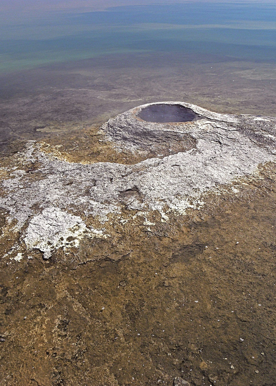 Aerial view of a Fishing Cone spring, Yellowstone, with surrounding landscape