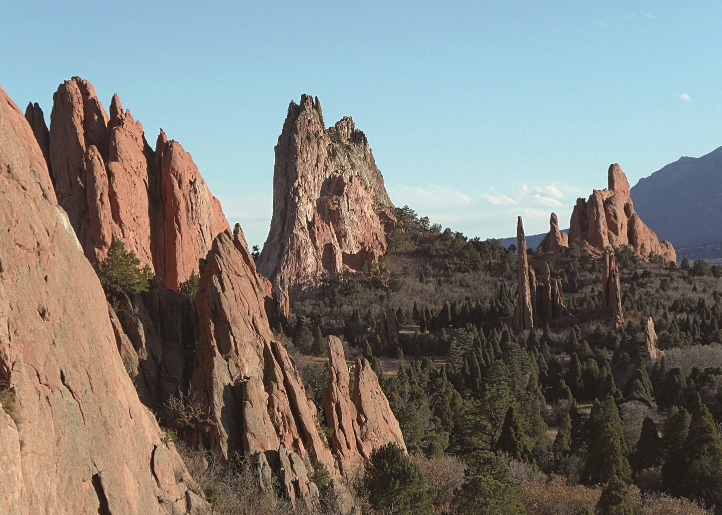 Rock formations in a natural landscape with trees and clear sky, Garden of the Gods, Colorado 