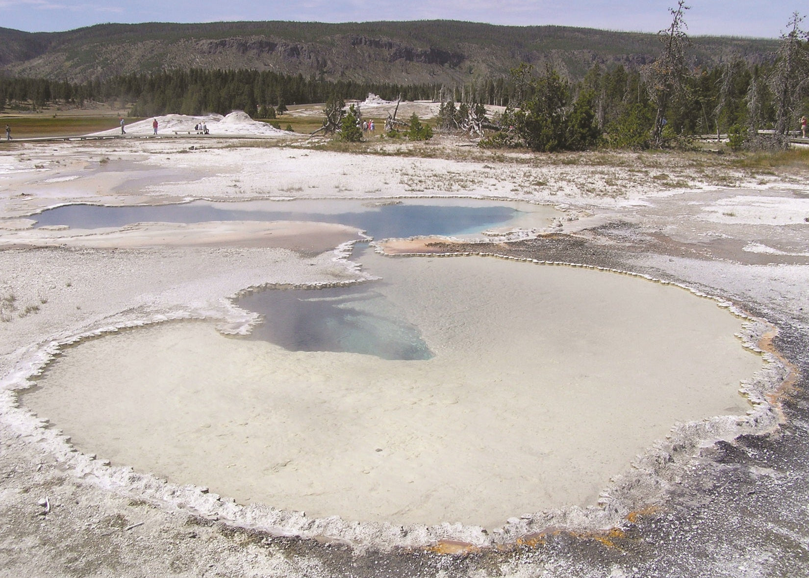 Dissolved silica scatters blue light waves and is responsible for the striking blue color of Doublet Pool.  Yellowstone National Park