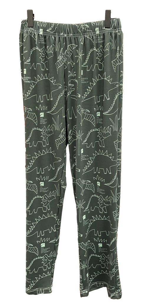 white line drawings of dinosaurs and the GSA logo on dark green pajama pants