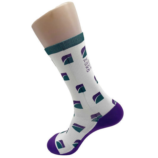 White sock with a green top band, purple heal and toe, and purple and green GSA logo. They have The Geological Society of America printed on them. 
