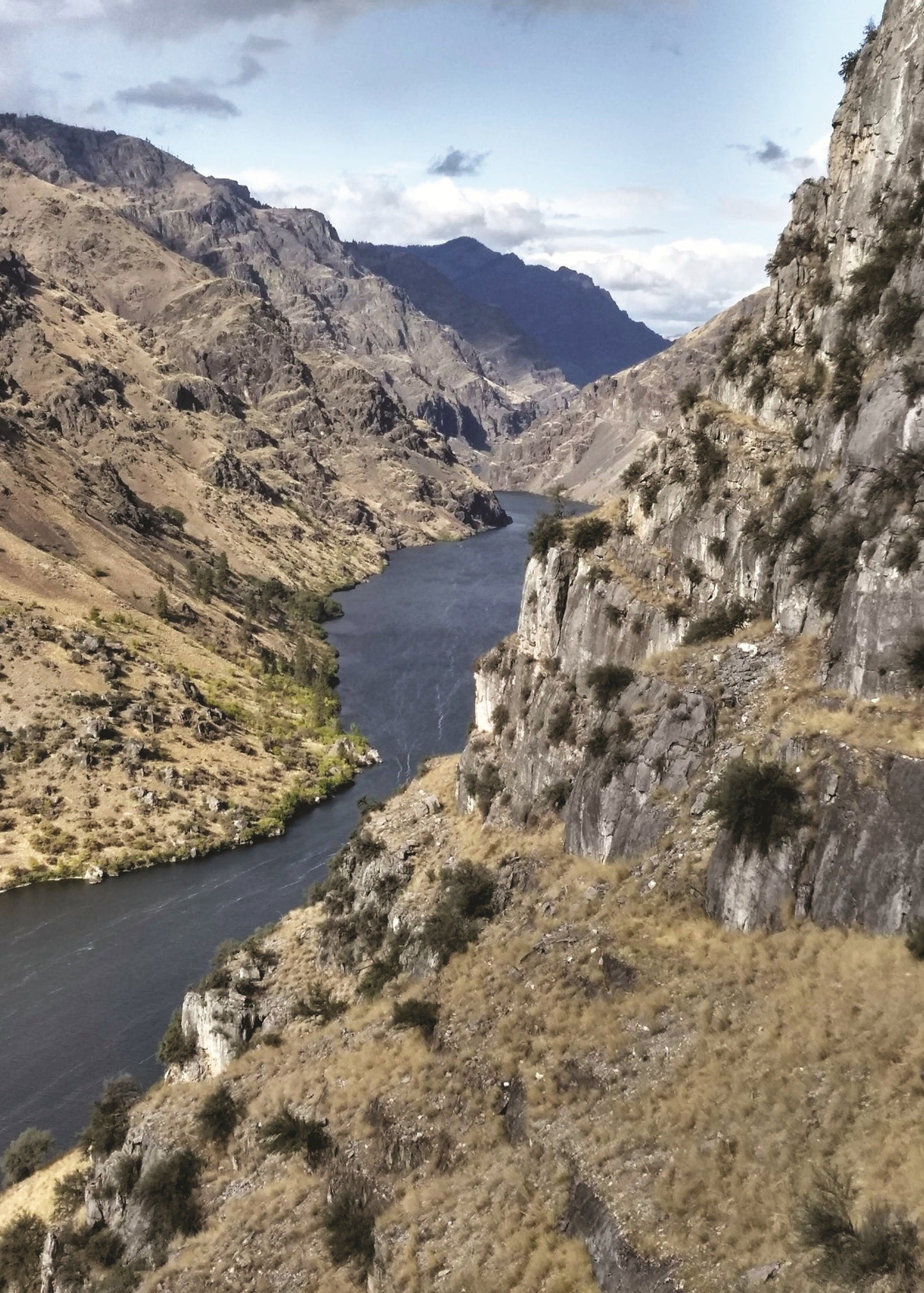 River winding through a mountainous landscape with rocky cliffs, Idaho