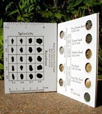 A pocket-sized sand grain sizing folder, open to display various charts and grain samples.
